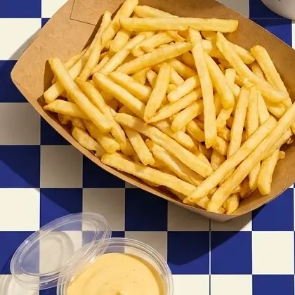 Shoestring fries in a kraft paper boat
